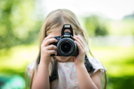 Girl taking picture people